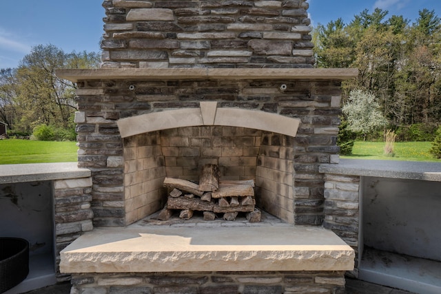 details featuring an outdoor stone fireplace