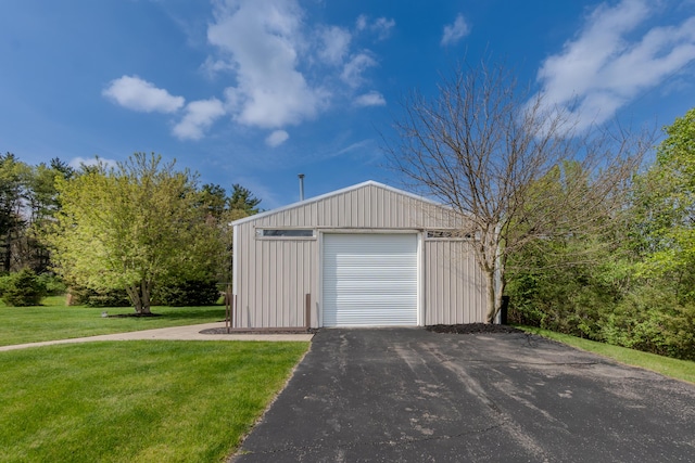 detached garage featuring driveway