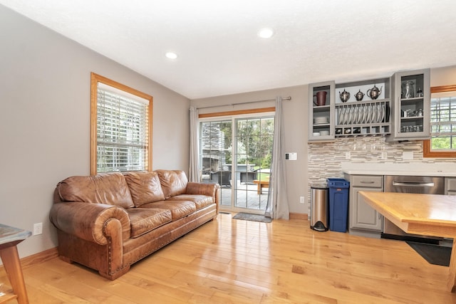 living room featuring recessed lighting and light wood-type flooring