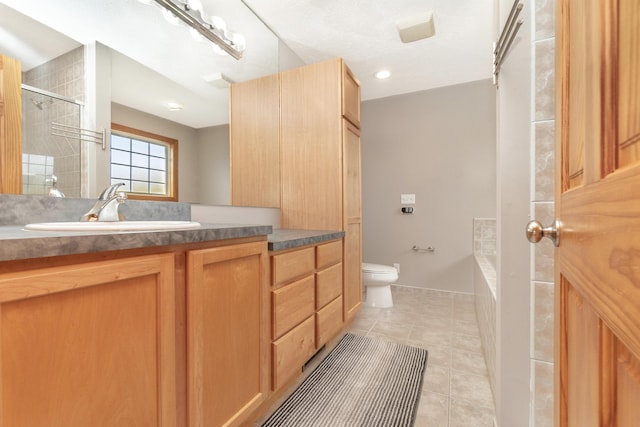 bathroom with toilet, a stall shower, tile patterned flooring, a washtub, and vanity