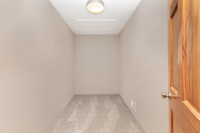 spare room with carpet and visible vents