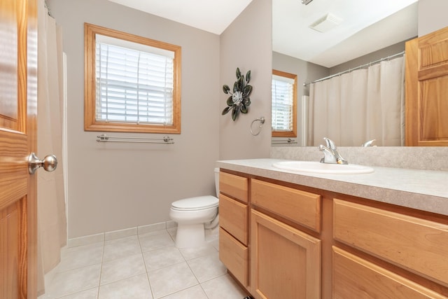 full bathroom with toilet, vanity, visible vents, tile patterned flooring, and baseboards