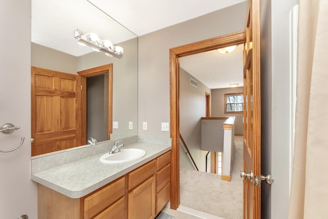 bathroom featuring visible vents and vanity