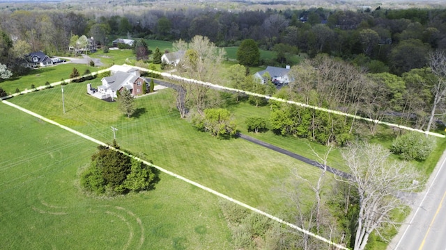 birds eye view of property with a rural view