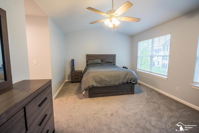 bedroom featuring carpet, vaulted ceiling, and baseboards