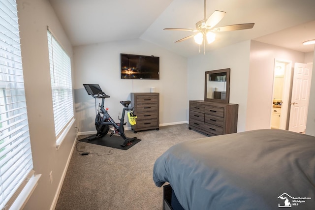 carpeted bedroom with multiple windows, baseboards, and lofted ceiling