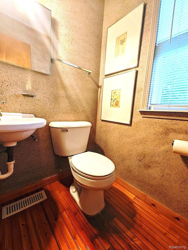 3385 Muerknoll Dr, Troy, MI 48084 - half bath featuring toilet and wood finished floors