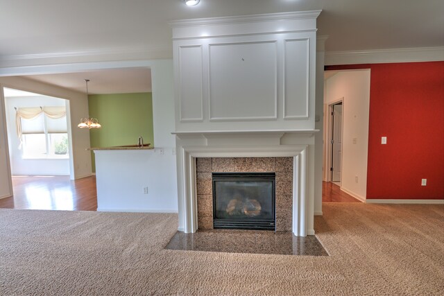 24179 Charlevoix St, Flat Rock, MI 48134 - detailed view of carpet floors, ornamental molding, a tile fireplace, baseboards, and a chandelier