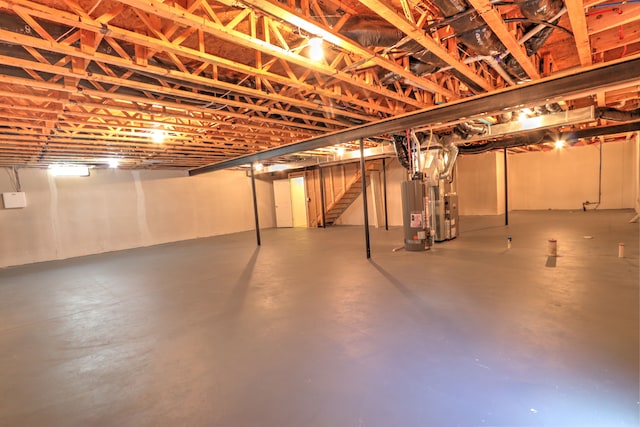 24179 Charlevoix St, Flat Rock, MI 48134 - unfinished basement with gas water heater and stairs
