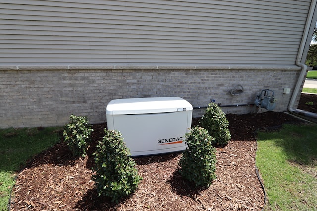 24179 Charlevoix St, Flat Rock, MI 48134 - exterior view of a power unit, brick siding, and gas meter