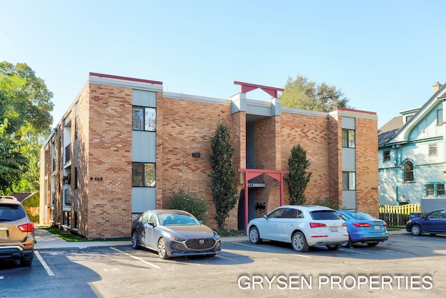 view of property with uncovered parking