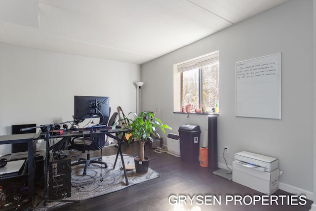 office area with baseboards and wood finished floors
