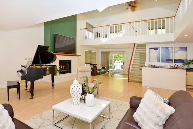 5100 Kings Gate Way, Bloomfield Hills, MI 48302 - living room featuring wood finished floors, stairs, a brick fireplace, ceiling fan, and recessed lighting