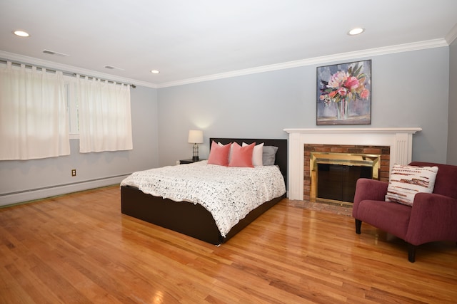 5100 Kings Gate Way, Bloomfield Hills, MI 48302 - bedroom with light wood-style floors, ornamental molding, recessed lighting, a brick fireplace, and a baseboard radiator