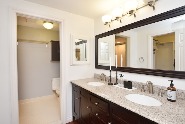5100 Kings Gate Way, Bloomfield Hills, MI 48302 - bathroom with toilet, double vanity, and baseboards