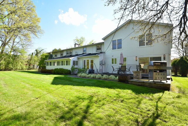 5100 Kings Gate Way, Bloomfield Hills, MI 48302 - back of property featuring a yard, a patio, and a chimney