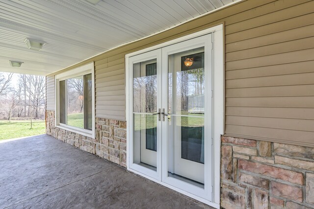 4780 Dutcher Rd, Howell, MI 48843 - doorway to property featuring stone siding and french doors