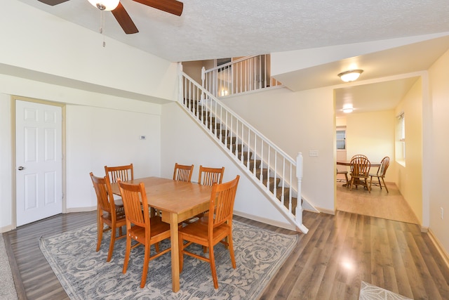 4780 Dutcher Rd, Howell, MI 48843 - dining area with stairway, ceiling fan, a textured ceiling, and wood finished floors
