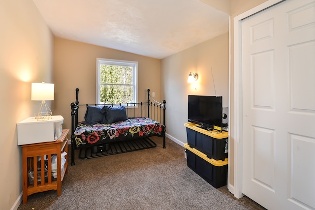 4780 Dutcher Rd, Howell, MI 48843 - carpeted bedroom featuring baseboards