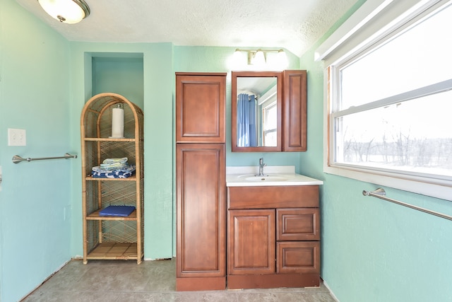 4780 Dutcher Rd, Howell, MI 48843 - bathroom with a textured ceiling and vanity