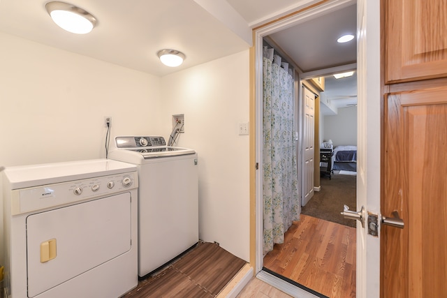 4780 Dutcher Rd, Howell, MI 48843 - laundry area with light wood-style flooring and washer and dryer