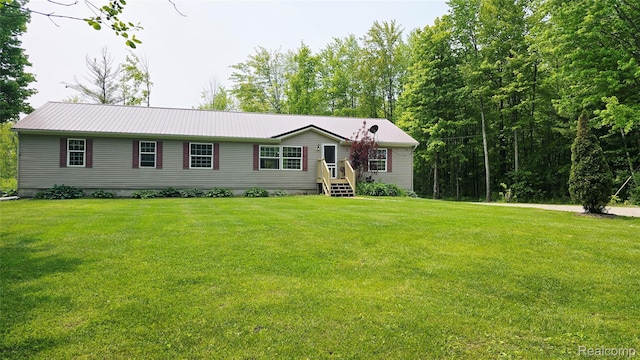 5303 Dove Rd, Kimball, MI 48074 - manufactured / mobile home featuring a front yard and metal roof