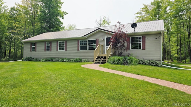 5303 Dove Rd, Kimball, MI 48074 - view of front of property featuring metal roof and a front yard