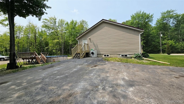 5303 Dove Rd, Kimball, MI 48074 - view of home's exterior featuring ac unit and a deck