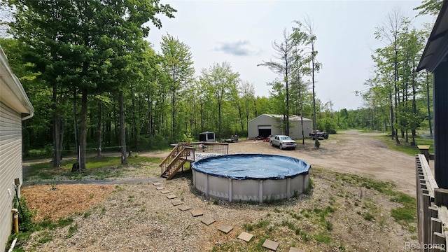 5303 Dove Rd, Kimball, MI 48074 - view of yard featuring an outbuilding and a covered pool