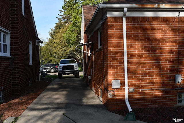 view of home's exterior with brick siding