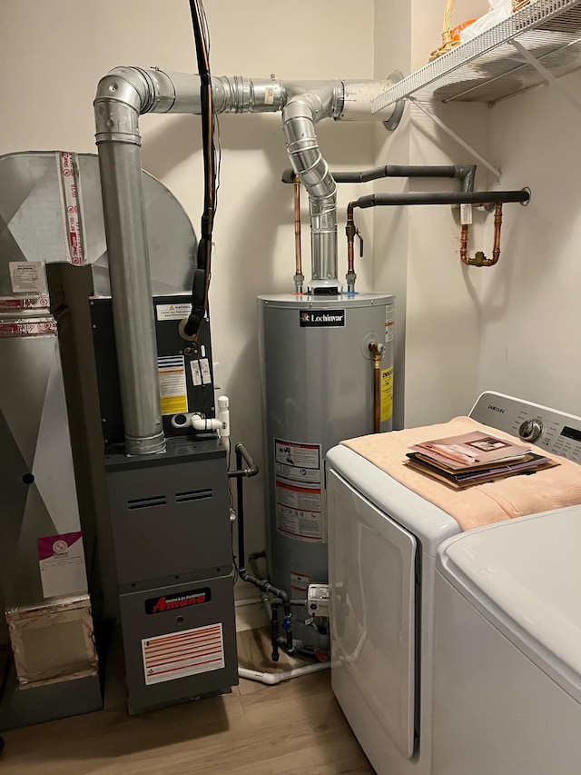 28848 5 Mile Rd Unit 11, Livonia, MI 48154 - utility room with washing machine and dryer and gas water heater