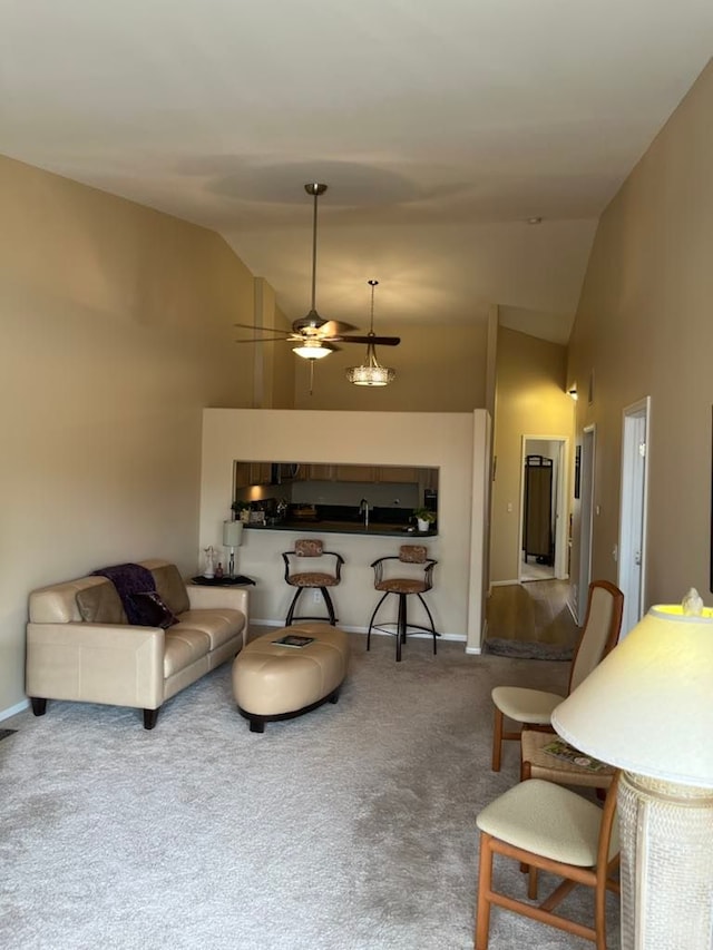 28848 5 Mile Rd Unit 11, Livonia, MI 48154 - living area with baseboards, carpet floors, ceiling fan, and high vaulted ceiling
