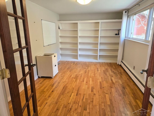 8570 Hornbeam Ln, Saginaw, MI 48603 - spacious closet with light wood-style floors and baseboard heating
