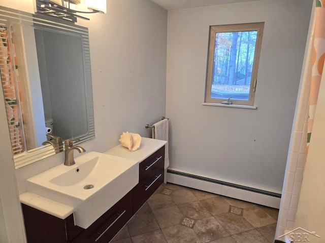 8570 Hornbeam Ln, Saginaw, MI 48603 - full bath featuring vanity, tile patterned flooring, and a baseboard heating unit