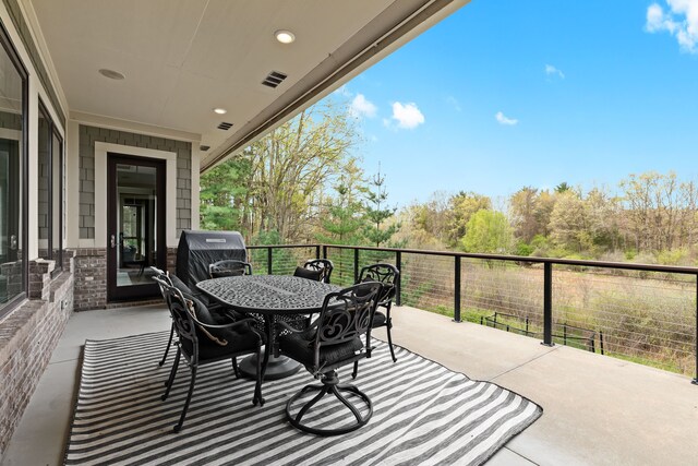 5744 Wyndam Ln, Brighton, MI 48116 - balcony featuring outdoor dining area