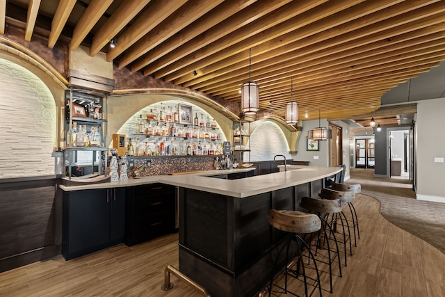 5744 Wyndam Ln, Brighton, MI 48116 - bar with a community bar, decorative light fixtures, a ceiling fan, and beam ceiling