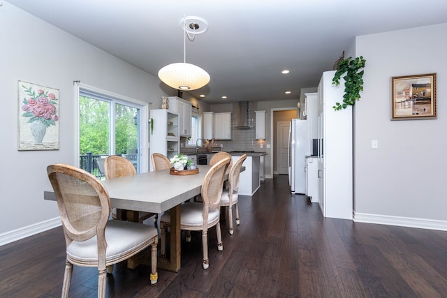 dining space featuring dark wood-style flooring, baseboards, and recessed lighting