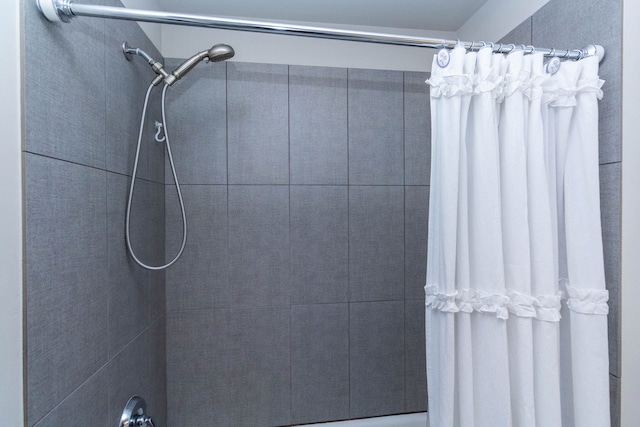 full bathroom with tiled shower