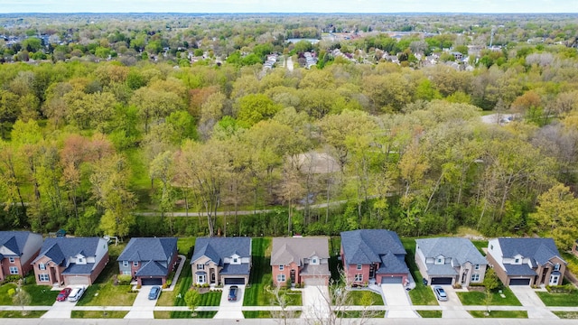 bird's eye view featuring a view of trees and a residential view