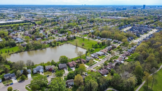 drone / aerial view featuring a water view and a residential view