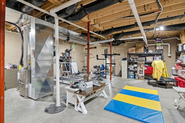 unfinished below grade area featuring heating unit