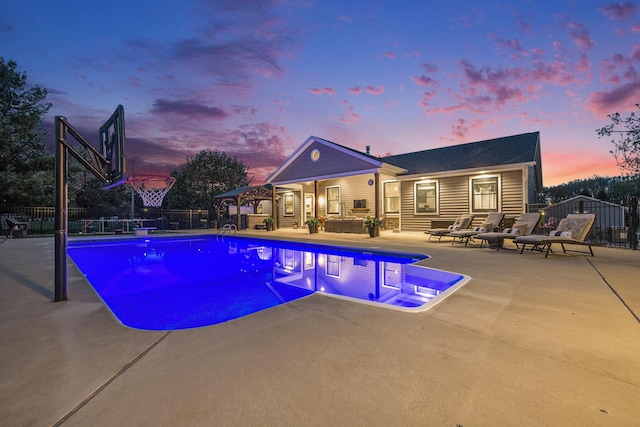 view of pool with fence, a patio area, an outdoor living space, and a fenced in pool