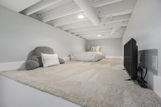 bedroom with baseboards and carpet flooring
