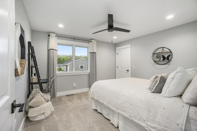 bedroom with visible vents, light carpet, baseboards, and recessed lighting