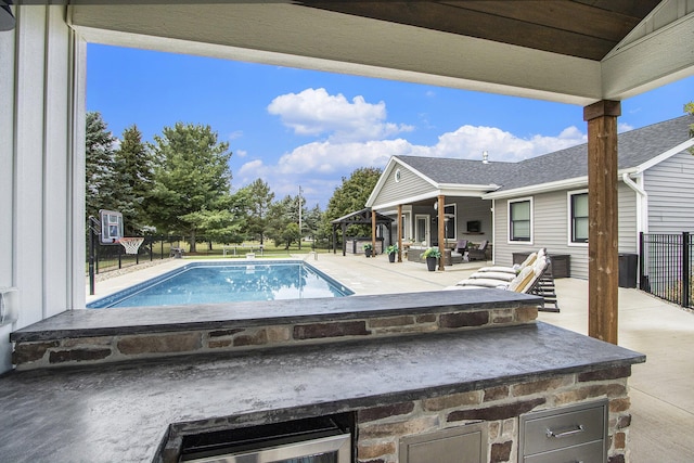 view of pool with a patio area and a fenced in pool