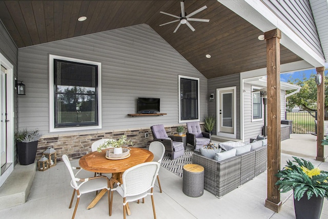 view of patio featuring outdoor dining area, a ceiling fan, and an outdoor living space