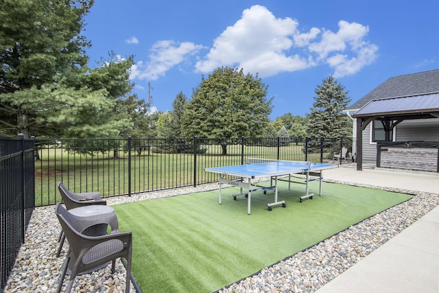 view of yard featuring a patio, fence, and a gazebo