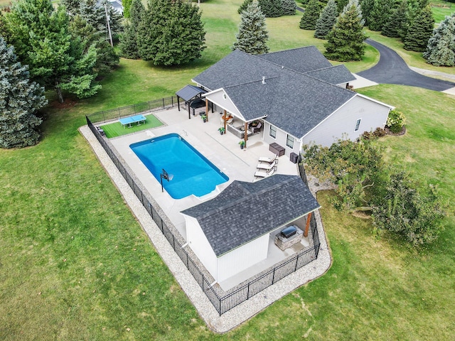 view of pool with a fenced backyard, a patio area, a fenced in pool, and a lawn