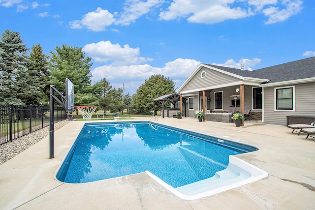 view of swimming pool featuring outdoor lounge area, fence, a gazebo, a patio area, and a fenced in pool
