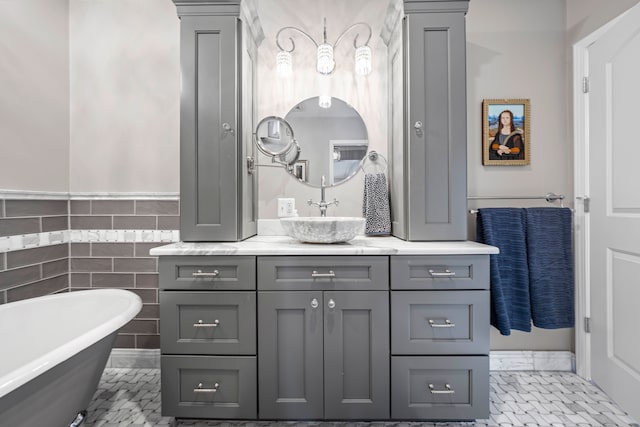 33 Sylvan Ave, Pleasant Ridge, MI 48069 - bathroom featuring vanity, tile walls, a wainscoted wall, and a freestanding tub